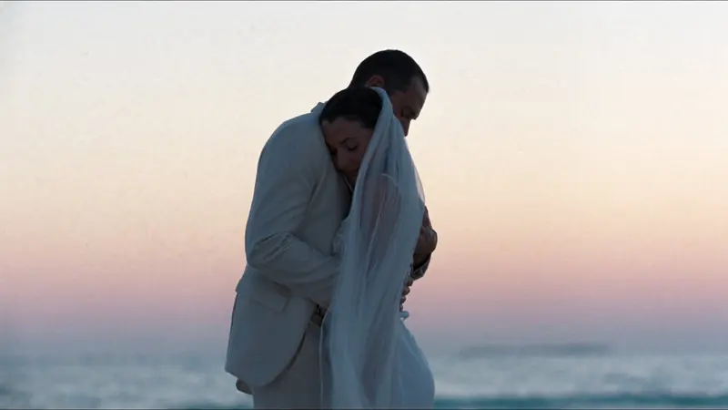 Visual reference: a couple embracing on a beach